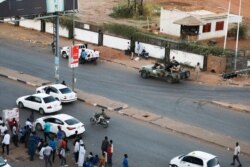 Members of the Rapid Support Forces, a paramilitary force operated by the Sudanese government, block roads in Khartoum, Sudan, Jan. 14, 2020.