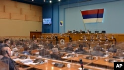 FILE - Bosnian Serb's lawmakers take part in the parliament session in Banja Luka, Dec. 10, 2021. Lawmakers, Dec. 25, 2024, ordered Serb representatives in state institutions to block decision-making and reform laws needed for the Balkan country's integration into the EU. 