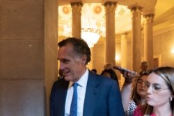 FILE - Sen. Mitt Romney, R-Utah, arrives for a meeting at the Capitol in Washington, Wednesday, June 23, 2021.