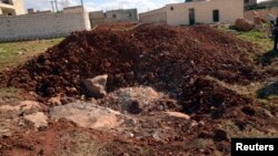 A general view shows what forces loyal to Syria's President Bashar al-Assad say is the site where Tuesday's chemical weapon attack occurred, March 23, 2013. 