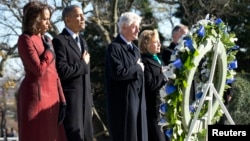 President Barack Obama (2nd L), first lady Michelle Obama (L), former President Bill Clinton (3rd L) and Hillary Clinton participate in a wreath-laying in honor of assassinated U.S. President John F. Kennedy at Arlington National Cemetery, near Washington D.C., Nov. 20, 2013.