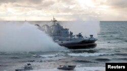 FILE - A military vessel is seen during the joint war games Zapad-2013 (West-2013), at the Khmelevka range on Russia's Baltic Sea in the Kaliningrad Region, Sept. 26, 2013. The Zapad 2017 exercises are set for September.