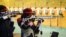 FILE - Shimaa Hashad of Egypt takes part in a pratice session with an air rifle at the International Shooting Sport Federation (ISSF) World Cup at Dr. Karni Singh Shooting Range, in New Delhi, Feb. 20, 2019.