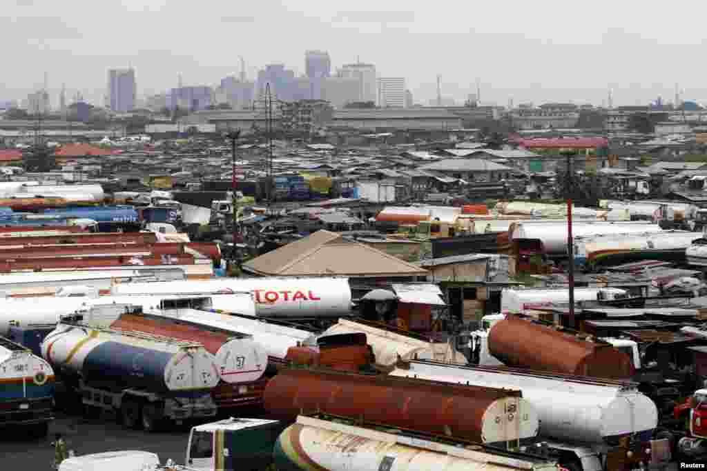 Trucks are seen parked around an automobile workshop overlooking the Lagos business district at the Orile-Iganmu in Lagos.