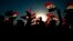 Followers of a political movement called the Al-Fateh Alliance chant during a rally before the parliamentary elections in Baghdad, Iraq, Oct. 7, 2021.