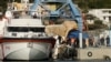 A group of migrants embark on an Italian ship at Shengjin port in Albania on Oct. 19, 2024. The 12 migrants left Albania for Italy after judges ruled against their detention in the non-EU nation under a controversial deal between Rome and Tirana.