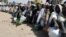 FILE - Internally displaced persons wait to be served with food at Dikwa camp, in northeast Nigeria's Borno state, Feb. 2, 2016. The U.N is hoping to raise  $1 billion to meet the needs of nearly seven million victims of the Boko Haram insurgency in northeast Nigeria.