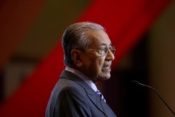 FILE - Malaysia's Prime Minister Mahathir Mohamad speaks during the signing ceremony for Bandar Malaysia in Putrajaya, Malaysia, Dec. 17, 2019.