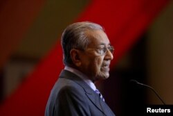FILE - Malaysia's Prime Minister Mahathir Mohamad speaks during the signing ceremony for Bandar Malaysia in Putrajaya, Malaysia, Dec. 17, 2019.