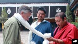 Ambassador Huntsman receives a scarf in a traditional Tibetan welcome at Jokhang Temple.