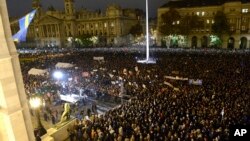 Demonstrators gather on the Kossuth Square in front of the Hungarian Parliament building during an anti-goverment demonstration called Day of Public Outcry in Budapest, Hungary, Nov. 17, 2014. 