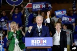 Democratic presidential candidate former Vice President Joe Biden speaks at a primary election night campaign rally in Los Angeles with his wife Jill Biden, left, and his sister Valerie, March 3, 2020.
