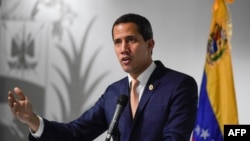 Venezuelan opposition leader Juan Guaido speaks during a news conference in Caracas, Oct. 17, 2019. Venezuela won a seat Thursday on the U.N. Human Rights Council, sparking an outcry from critics of its rights record.