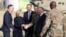U.S. Defense Secretary James Mattis, second from right, and NATO Secretary General Jens Stoltenberg, center, are welcomed by U.S. General John Nicholson after arriving at Resolute Support Mission headquarters in Kabul, Afghanistan, Sept. 27, 2017. 