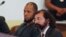 Siraj Ibn Wahhaj, left, sits next to public defense attorney Aleks Kostich at a first appearance in New Mexico state district court in Taos, N.M., Aug. 8, 2018, on accusations of child abuse and abducting his son from the boy's mother. 