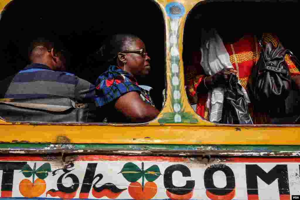 Christina, at center, say she prefers to travel by cars rapide, calling them faster than bigger and more modern buses. (R. Shryock/VOA)