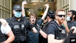 Demonstrators protest the death of George Floyd, a black man who died in police custody in Minneapolis, May 29, 2020, in Washington, near the White House Minority Leader Kevin McCarthy of Calif.