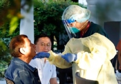 Philippine President Rodrigo Duterte undergoes testing for COVID-19 at the Malacanang Palace, Manila, Philippine officials say Duterte is being tested for the new virus after meeting with Cabinet officials who were exposed to infected people.