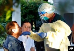 Philippine President Rodrigo Duterte undergoes testing for COVID-19 at the Malacanang Palace, Manila, Philippine officials say Duterte is being tested for the new virus after meeting with Cabinet officials who were exposed to infected people.