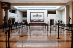 A smaller number of tourists visit the Capitol Visitors Center on Capitol Hill in Washington, March 12, 2020. Congress is shutting the Capitol to the public until April in reaction to the spread of the coronavirus, officials announced Thursday.