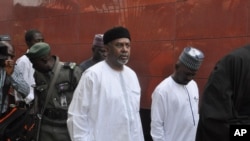 FILE - Nigeria's former national security adviser, Sambo Dasuki (C), arrives for a hearing at the Federal High Court in Abuja, Nigeria, Dec. 14, 2015.