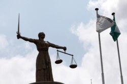 FILE - A Lady Justice statue stands outside the Court of Appeal in Abuja, Nigeria, Sept. 11, 2019.