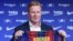 Barcelona's new Dutch coach Ronald Koeman poses during his official presentation at the Camp Nou stadium in Barcelona on August 19, 2020. - Crisis-hit Barcelona hailed the "return of a legend" as the Spanish giants today officially named Ronald Koeman as 