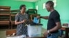 A voter casts his ballot at a polling station during Gabon's referendum in Libreville, Nov. 16, 2024. 