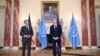 US Secretary of State Antony Blinken poses with International Atomic Energy Agency Director General Rafael Mariano Grossi in the Benjamin Franklin Room ahead of a meeting at the State Department in Washington, D.C., Oct. 18, 2021.