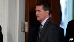 Mike Flynn arrives for a news conference in the East Room of the White House in Washington, Feb. 13, 2017.