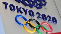 Ilustrasi - Logo Olimpiade Tokyo 2020 di Tokyo, Jepang, 15 Maret 2020. (CHARLY TRIBALLEAU / AFP)
