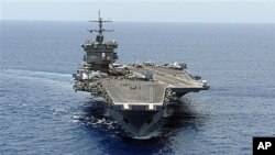In this photo provided by the US Navy, an aerial bow view of the aircraft carrier USS Enterprise is shown as it transits the Atlantic Ocean (File Photo)