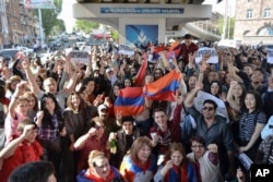 Yerevan residents celebrate Armenian Prime Minister's Serzh Sargsyan's resignation in Yerevan, Armenia, April 23, 2018.