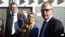 Parents of Swedish journalist and accused terrorist Johan Persson with Sweden's ambassador to Ethiopia, right, outside federal court, Addis Ababa, Dec. 21, 2011.