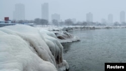 The city skyline is seen from the North Avenue Beach at Lake Michigan, as bitter cold phenomenon called the polar vortex has descended on much of the central and eastern United States, in Chicago, Illinois, U.S., January 29, 2019. REUTERS/Pinar Istek