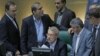 FILE - Iranian Parliament Speaker Ali Larijani (C), surrounded by lawmakers, speaks during a session in the capital Tehran, Aug. 28, 2018.