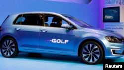 Volkswagen introduces the Volkswagen e-Golf electric car at the Los Angeles Auto Show. 