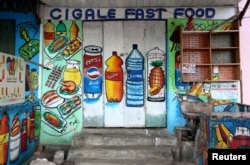 A mural on the wall of a fast food store illustrates food and drinks in Wabari district of Mogadishu, Somalia, June 8, 2017.