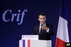 FILE - France's President Emmanuel Macron gives a speech during the 34rd annual dinner of the group CRIF, Representative Council of Jewish Institutions of France, in Paris, Feb. 20, 2019.