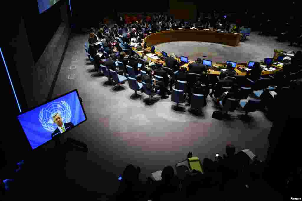 U.N. Ebola mission chief Anthony Banbury (on Screen) speaks to members of the United Nations Security Council during a meeting on the Ebola crisis at the U.N. headquarters in New York , October 14, 2014. REUTERS/Eduardo Munoz (UNITED STATES - Tags: POLITI