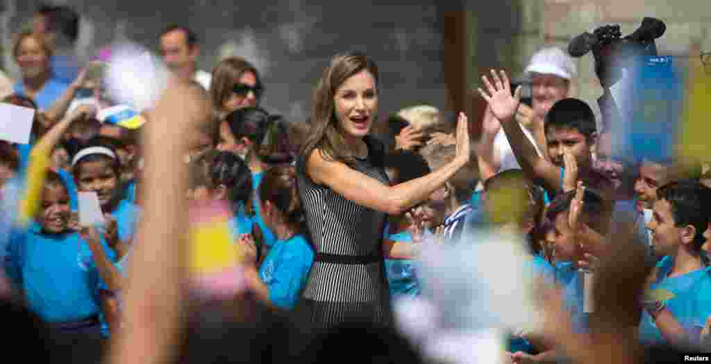 Spanish Queen Letizia is greeted by children at &quot;San Matias&quot; primary school during the inauguration of the school year in La Laguna.