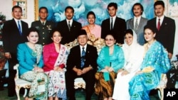 FILE - Hutomo Mandala Putra, popularly known as "Tommy", top row third from left, youngest son of former Indonesian President Suharto, bottom row third left, is pictured in this undated family photo in Jakarta, Indonesia.