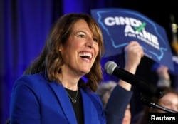 FILE - Democratic congressional candidate Cindy Axne reacts while appearing at her midterm election night party in Des Moines, Iowa, Nov. 6, 2018.