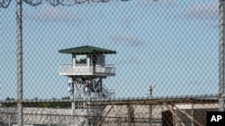 In this April 16, 2018, file photo, a guard tower stands above the Lee Correctional Institution, a maximum security prison in Bishopville, South Carolina.