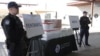 FILE - Packets of fentanyl mostly in powder form and methamphetamine, which U.S. Customs and Border Protection say it seized from a truck crossing into Arizona from Mexico, is on display during a news conference at the Port of Nogales, Arizona, Jan. 31, 2019.