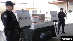 FILE - Packets of fentanyl mostly in powder form and methamphetamine, which U.S. Customs and Border Protection say it seized from a truck crossing into Arizona from Mexico, is on display during a news conference at the Port of Nogales, Arizona, Jan. 31, 2019.