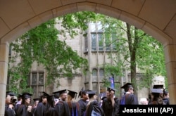 In this May 24, 2010 file photo, future graduates wait for the procession to begin for the graduation ceremony at Yale University in New Haven, Connecticut.