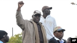 Senegalese opposition leader Macky Sall gestures as he attends a demonstration demanding that President Abdoulaye Wade drop plans to seek a third term in Dakar, Senegal, January 31, 2012.