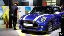 FILE - A MINI Cooper Cabrio is displayed at the China Auto Show in Beijing, China, April 26, 2018. BMW Group and China's biggest SUV brand, Great Wall Motor, announced, July 10, 2018, a partnership to produce electric MINI vehicles in China.
