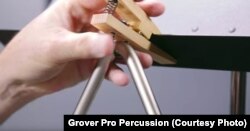 The Grover triangle clip clamps the instrument to a music stand and suspends it while being played so it resonates.